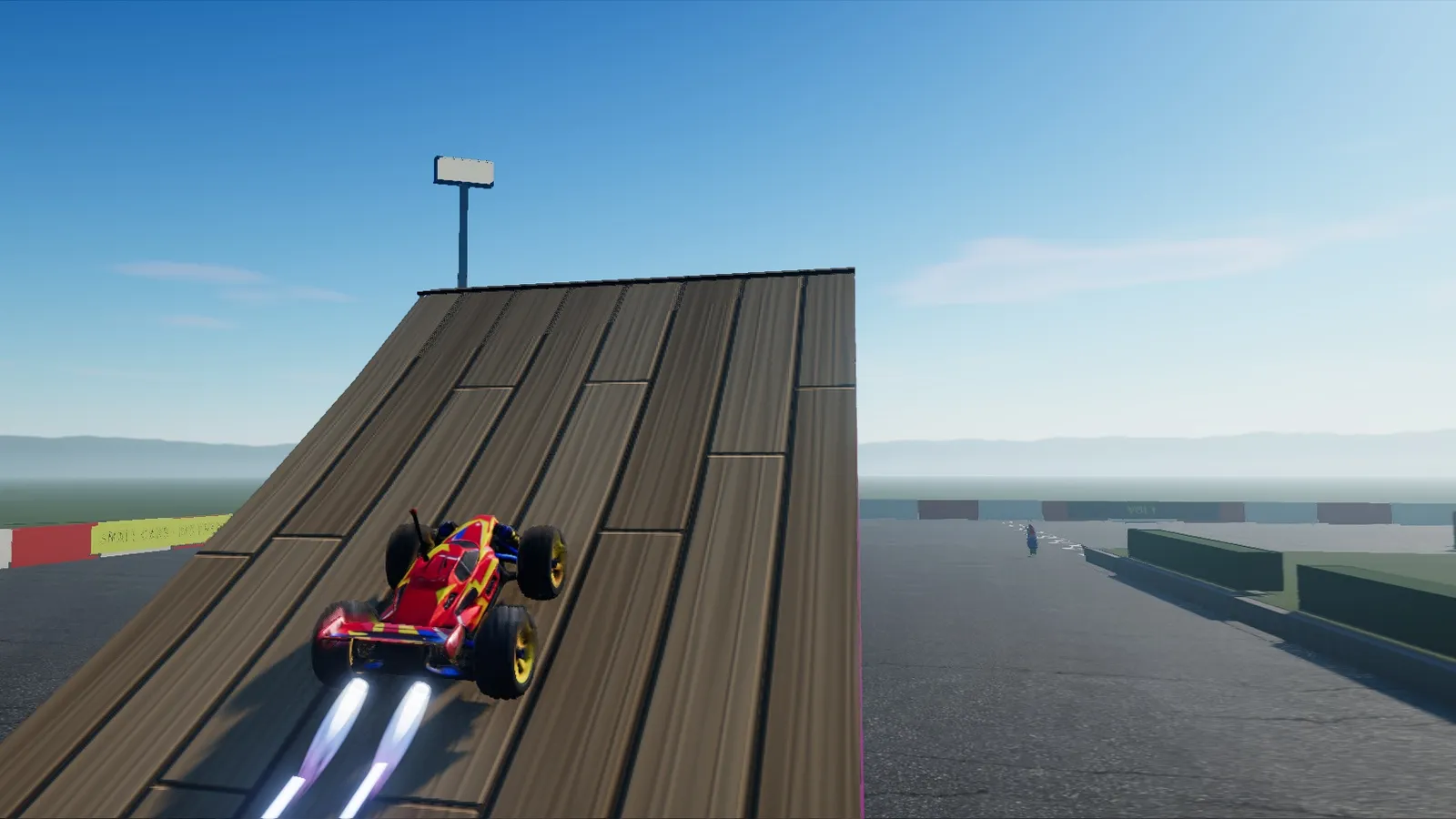 Stunt Arena : une voiture grimpe un tremplin monstre, le nitro allumé.